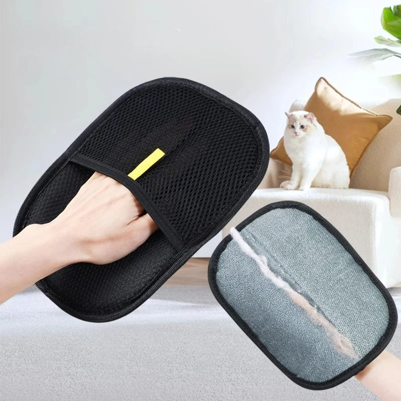 Pet hair removal mitt sweeping a dark garment