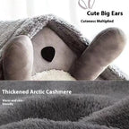 Close view of the gray plush bed roof and ears