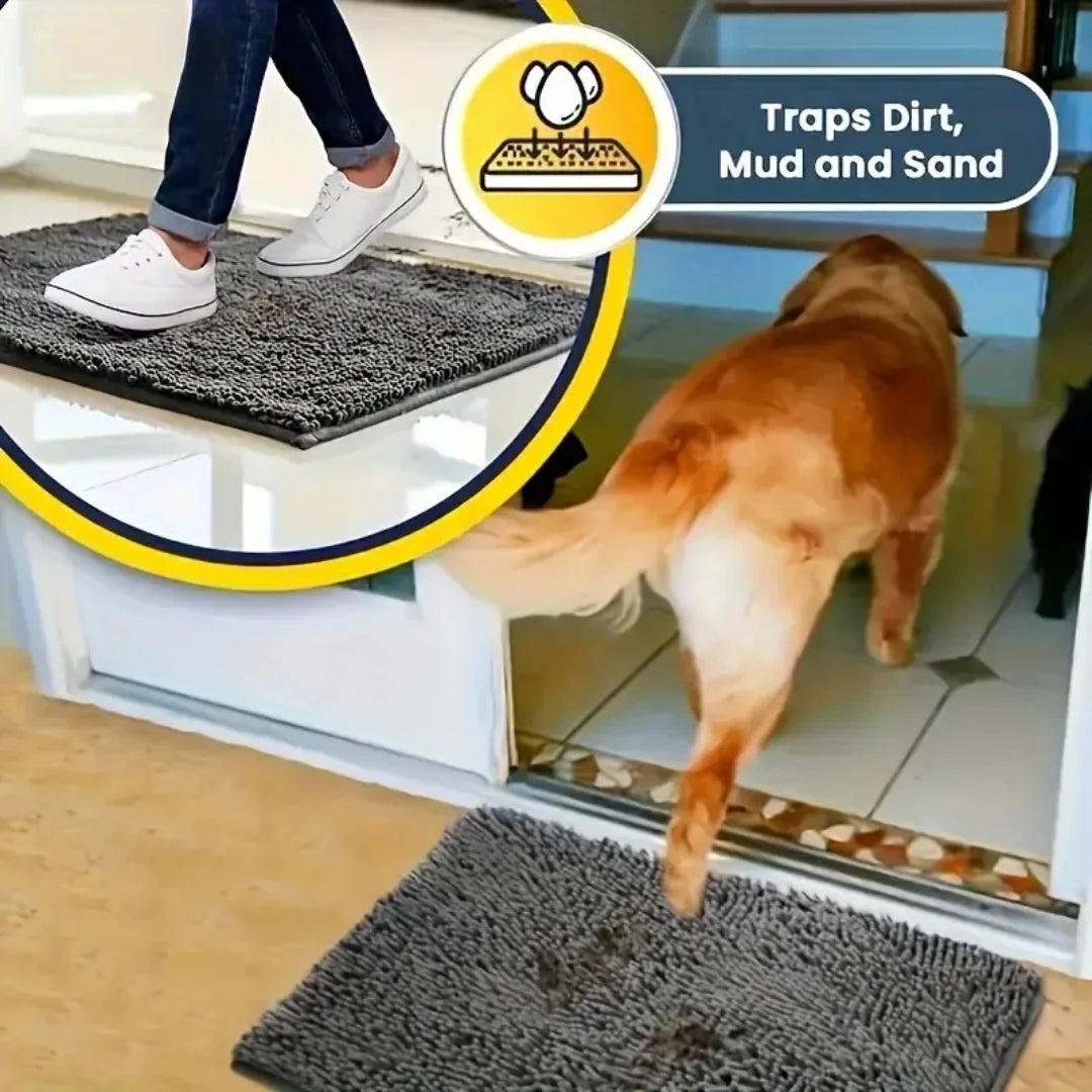 Gray mat catching dirt and mud at a pet entry