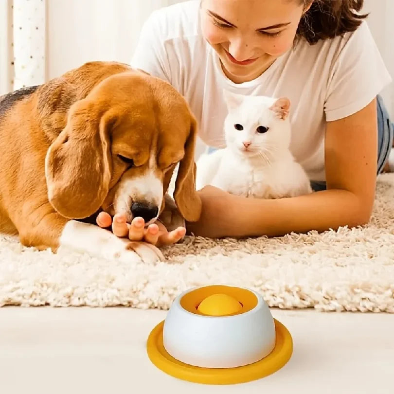 Dog and cat using the orange lick feeder