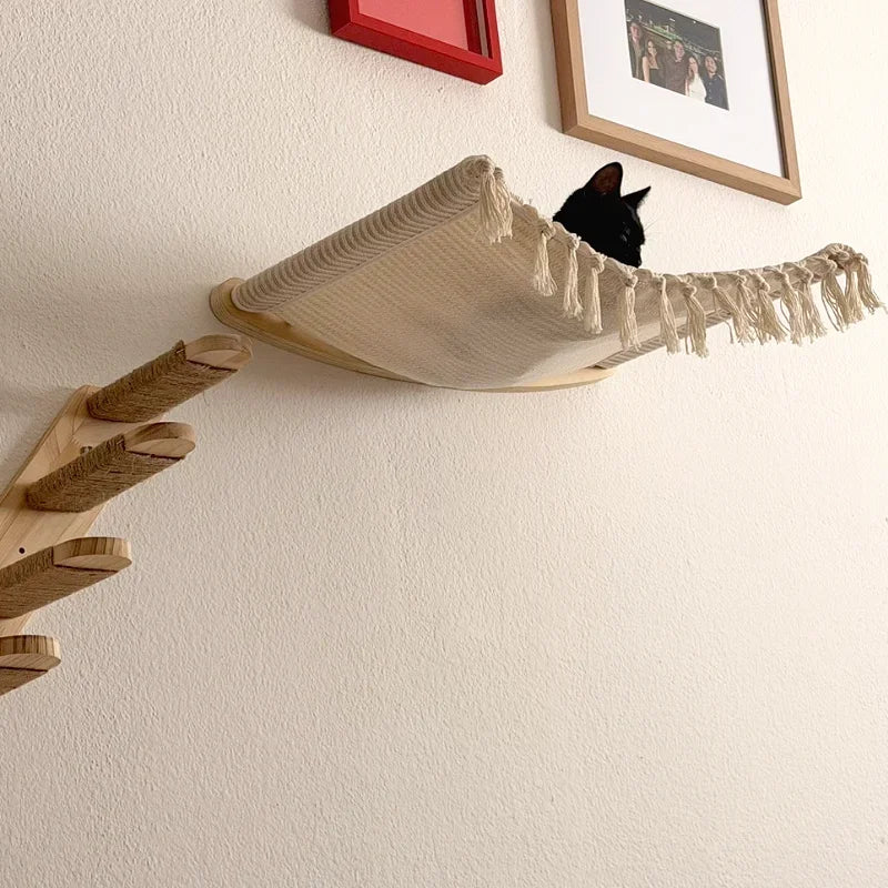 Cream fabric hammock and wall steps installed for a cat