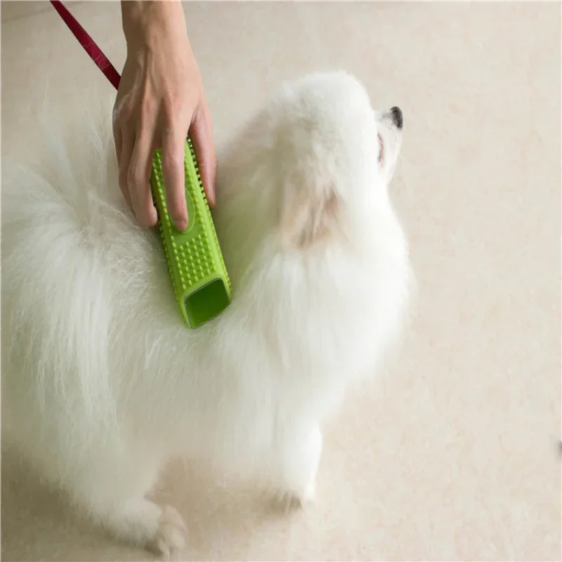 Green silicone brush used on a dog's coat