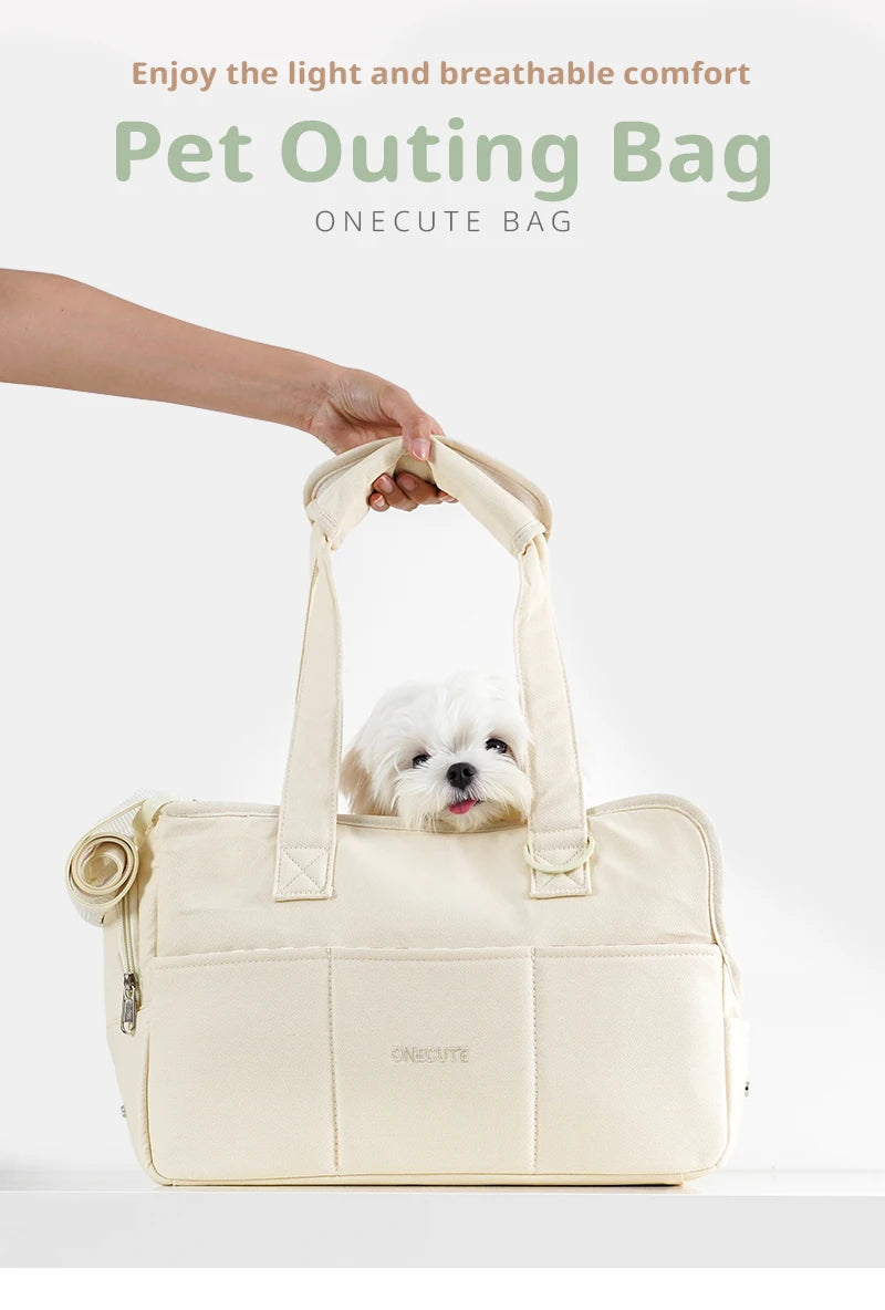 Beige pet carrier tote carried by hand