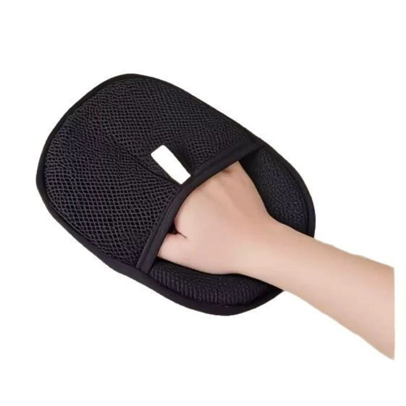 Black pet hair removal mitt on a white background