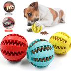 Rubber treat-dispensing dog balls in red, light blue and yellow