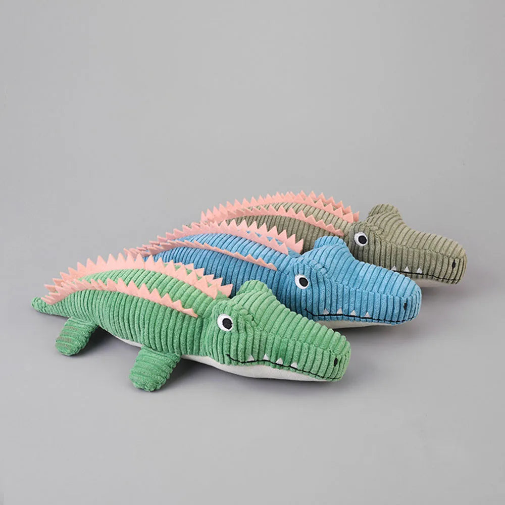 Green, blue, and gray crocodile plush toys