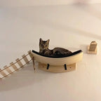 Moon-shaped cat hammock installed beside wall steps