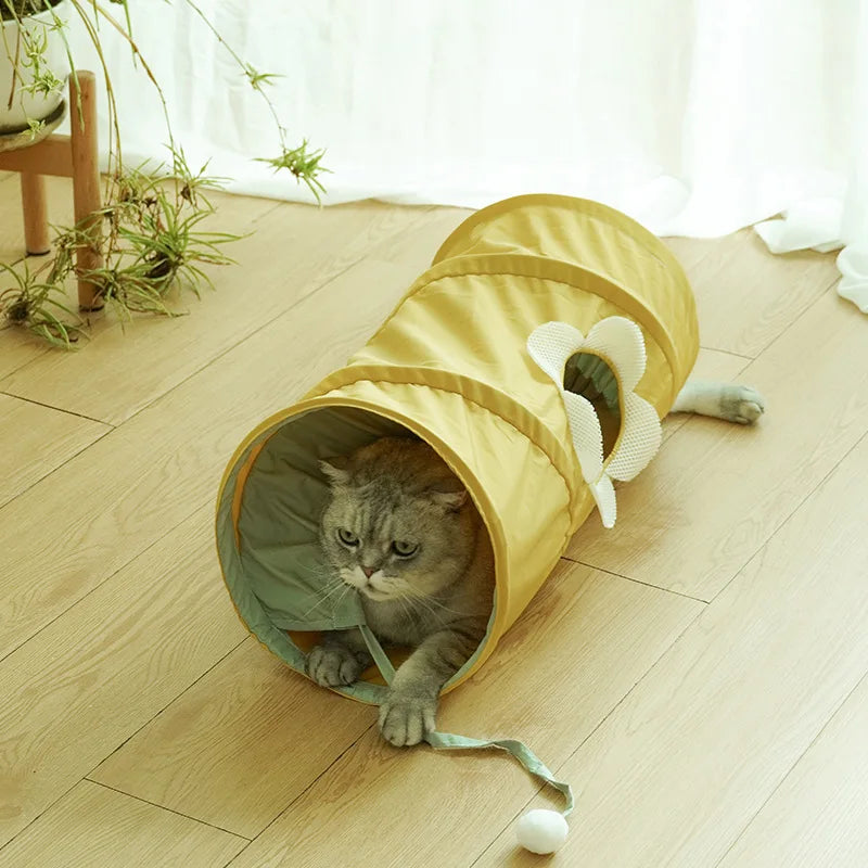 Yellow spiral cat tunnel in a room setting