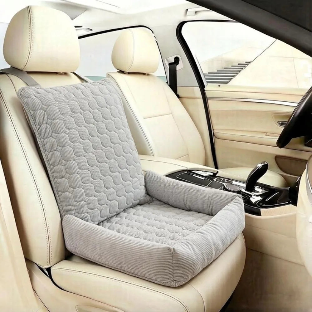 Gray padded single-seat pet car bed in a light vehicle interior
