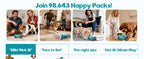 Dogs and owners using the treat dispenser indoors