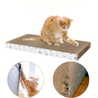Cat scratching a rectangular cardboard pad