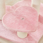 Close view of a pink plush heart platform