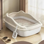 Beige high-sided litter box filled with cat litter
