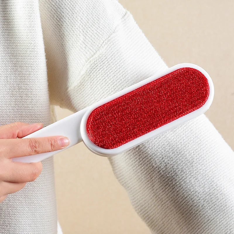 Directional lint brush sweeping white knit fabric