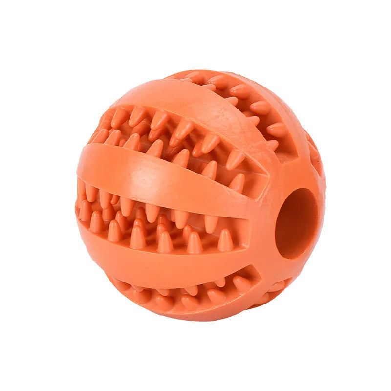 Orange rubber treat-dispensing dog ball