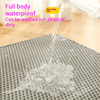 Water rinsing over the gray EVA litter mat