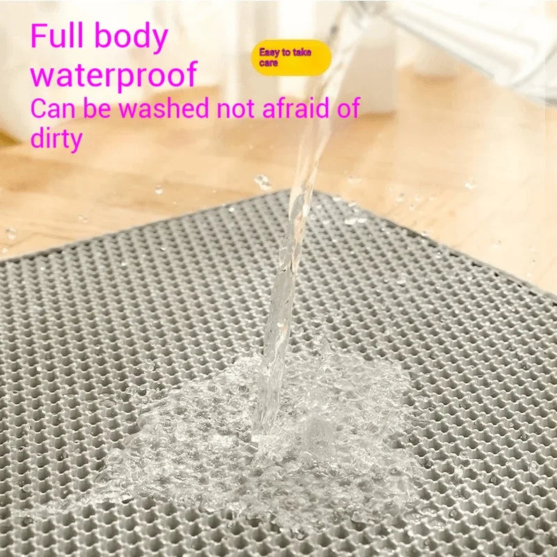 Water rinsing over the gray EVA litter mat