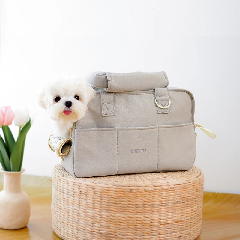 Gray cotton carrier tote with small pet