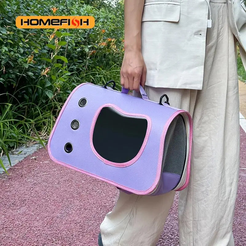 Pink foldable pet carrier in use