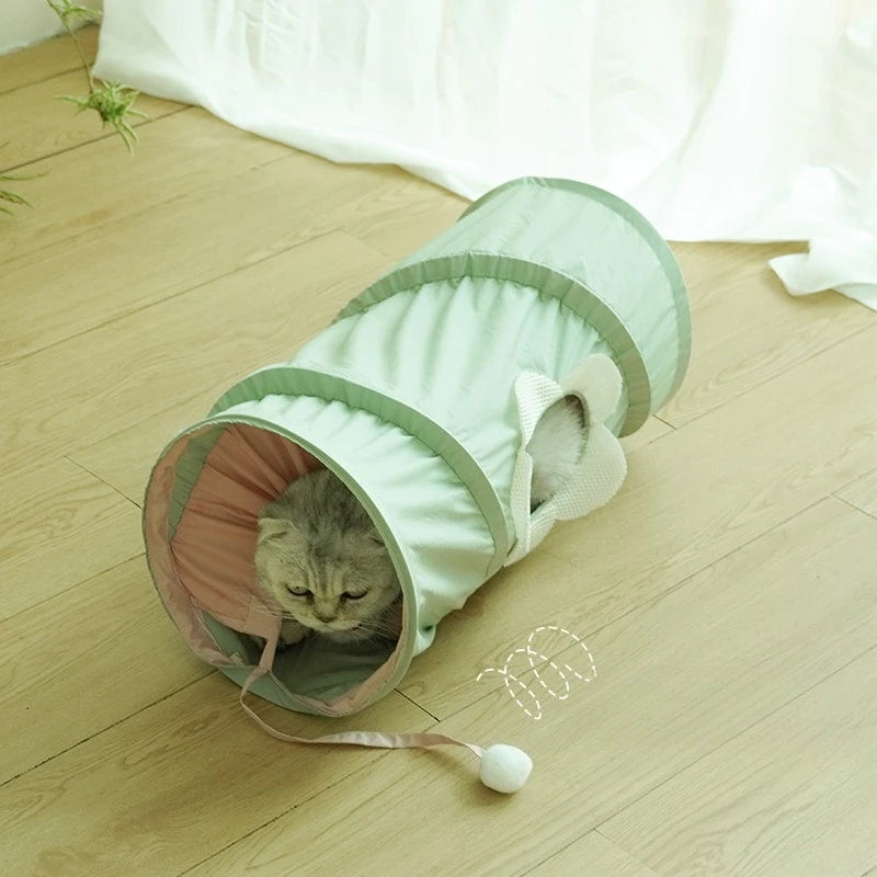 Green spiral cat tunnel in a room setting