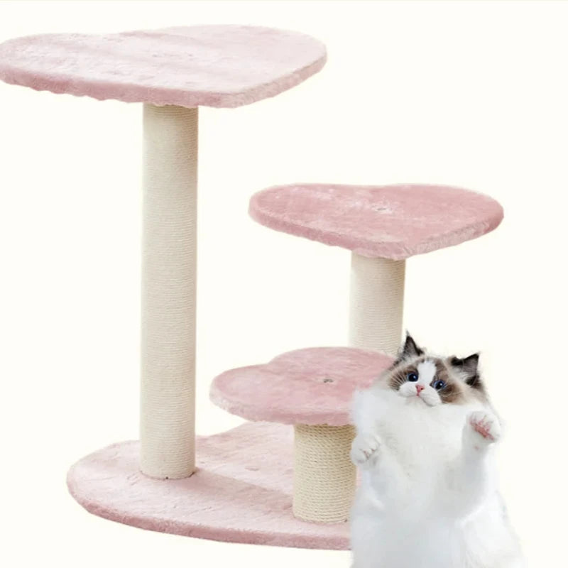 Cat beside the staggered pink cat-tree platforms